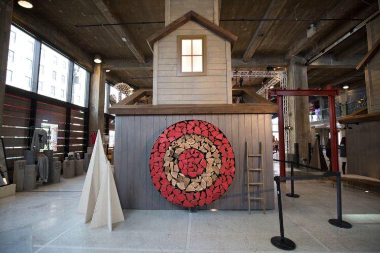 Exhibit showing the Target logo made of wood in the side of a house