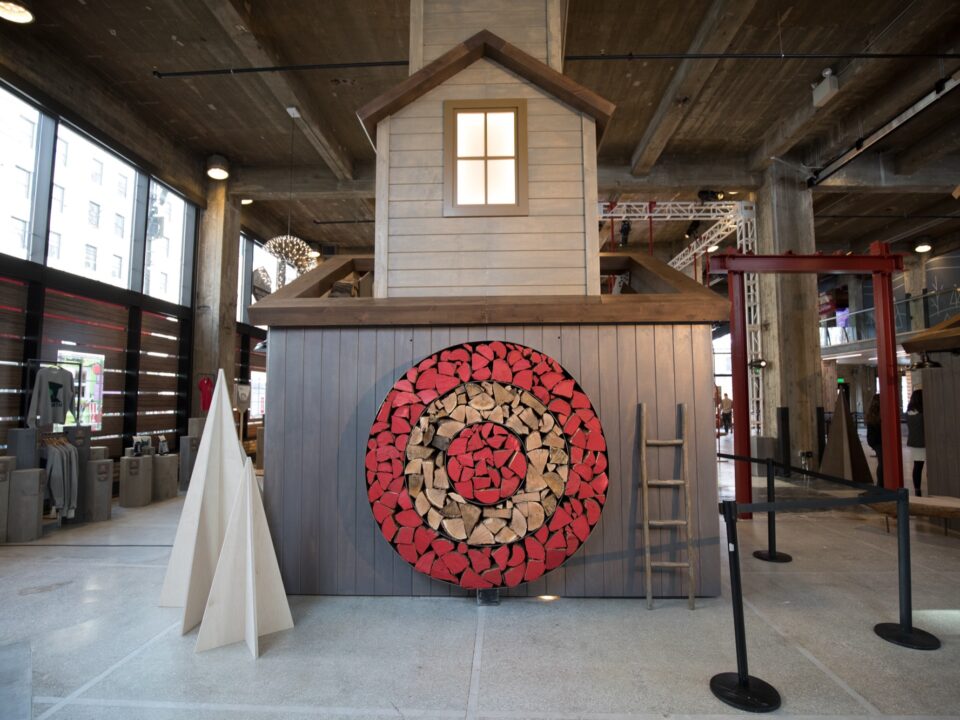 Exhibit showing the Target logo made of wood in the side of a house
