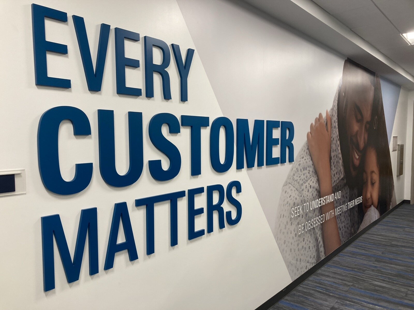Wall display in a hospital reading, "Every customer matters"