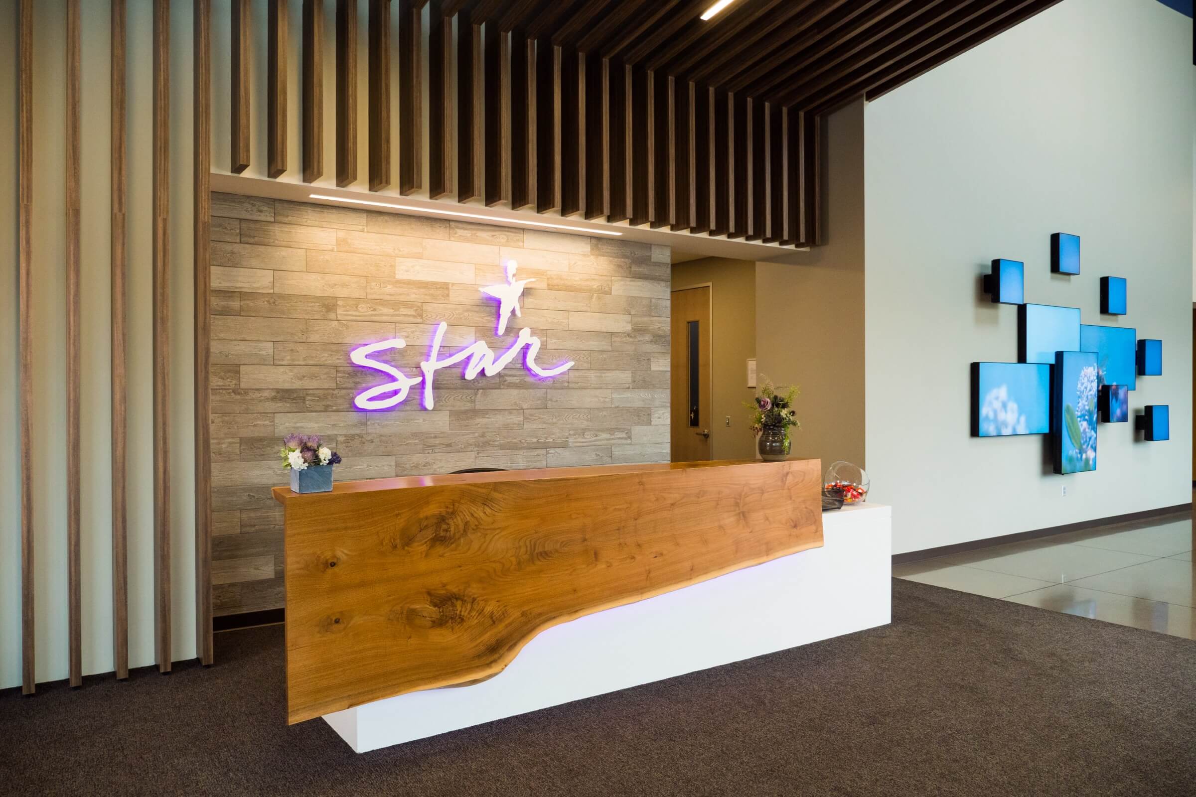 The entry area and reception desk of STAR's lobby