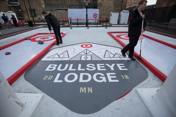 People playing on the Bullseye Lodge curling course