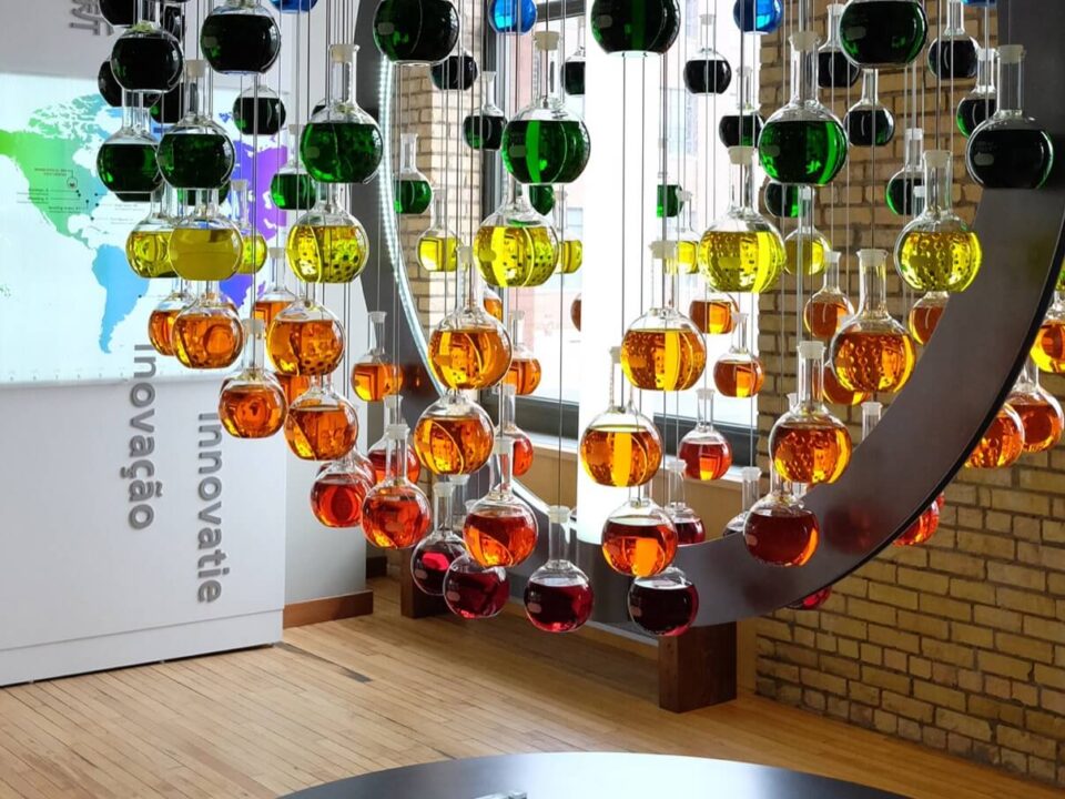 Science themed marketing display that uses flasks filled with colorful liquid