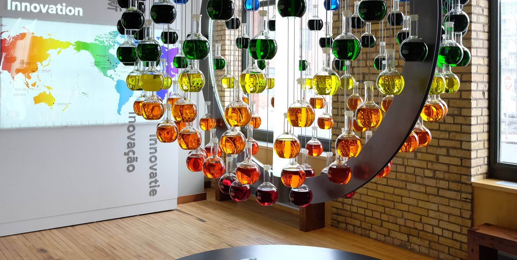 Science themed marketing display that uses flasks filled with colorful liquid