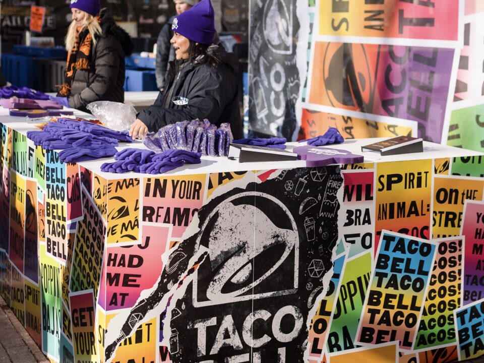 Taco Bell marketing booth with purple gloves on its countertop