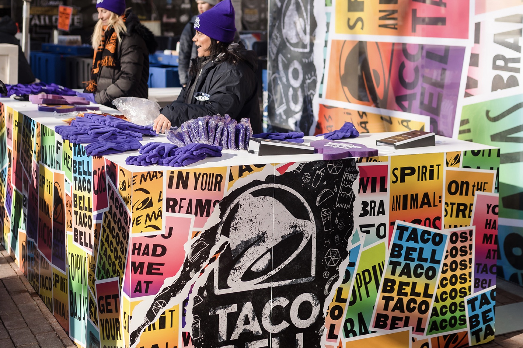 Taco Bell marketing booth with purple gloves on its countertop