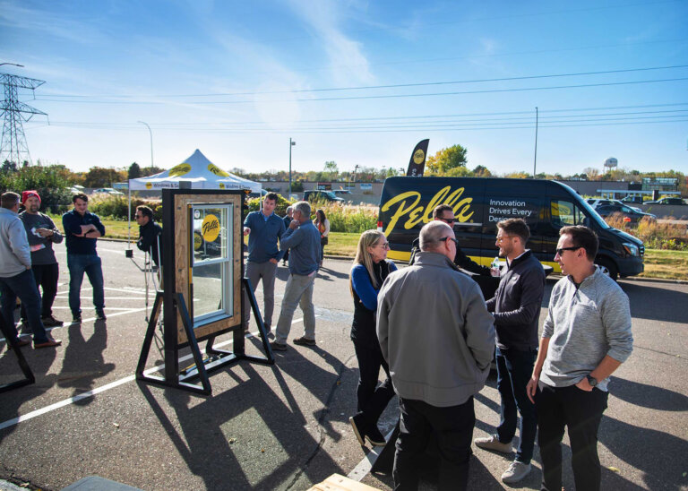 Team participating in window demo as part of a traveling trade show demonstration.