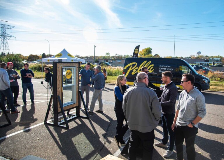 Team participating in window demo as part of a traveling trade show demonstration.