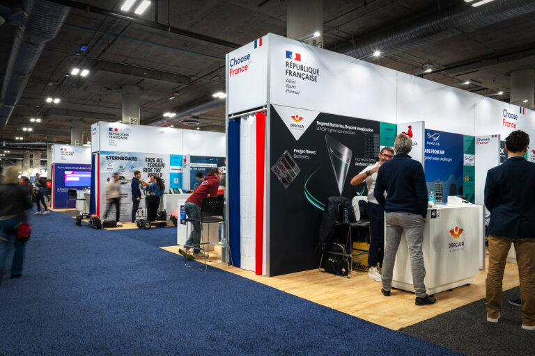 image of the CES 2025 Business France pavilion inside the trade show hall, showing 3 separate areas sectioned off by specialty walls to showcase a variety of French businesses