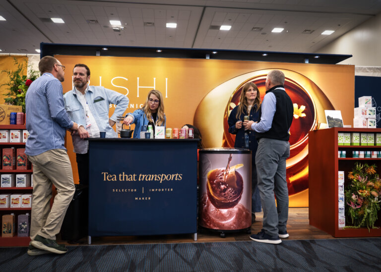 An image of the Rishi Tea 10x10 trade show display at Expo West 2025 featuring how they displayed their products and sampling in their exhibit space.