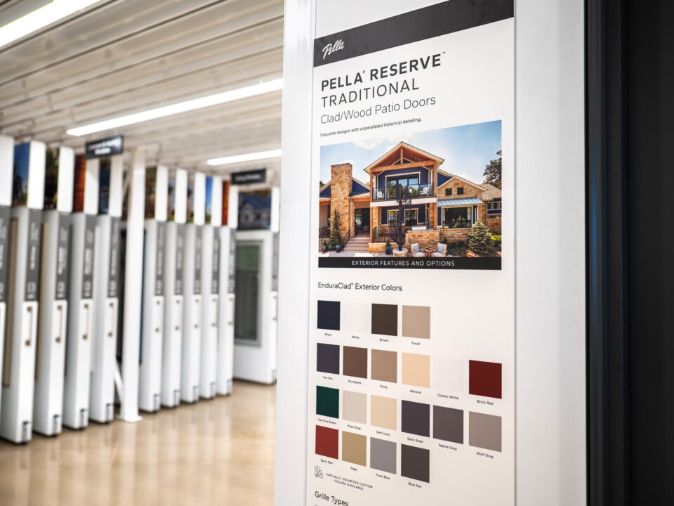 image from Pella Northland HQ, featuring Pella displays that are housed in the showroom space of the headquarters. These are custom built displays for Pella doors, that are neatly hung next to each other and are able to roll out to view the door and information on offerings and customizations.