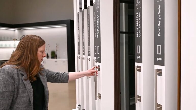 A client reads the information panel as she's about to pull out an interactive Pella window display found on the show floor at retail stores nationwide.