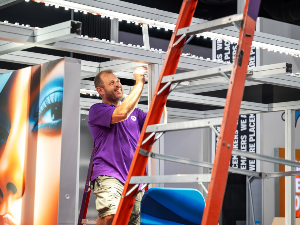 A STAR employee builds out the light-weight framing kit for an exhibit at a show.